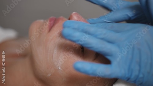 A closeup view of a relaxing facial treatment being performed in a serene and tranquil spa environment