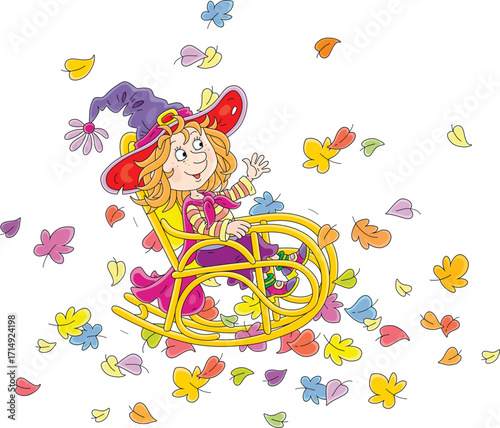 Happy little witch rocking in her old wooden rocker among colorful autumn leaves, vector cartoon illustration on a white background