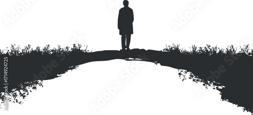 Silhouette of a person standing on a road reflecting nature in a serene landscape.