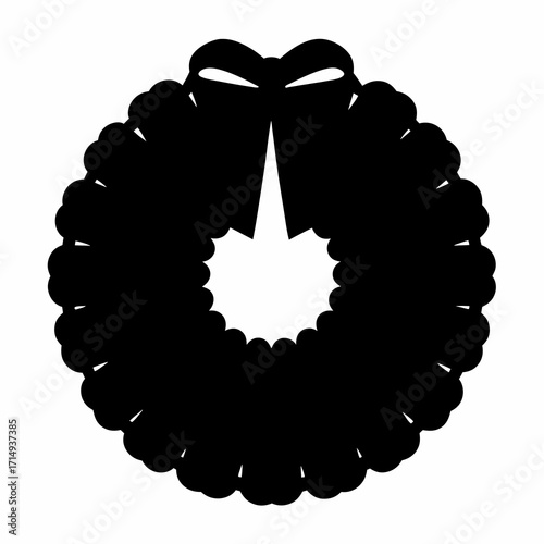 Black silhouette of a Christmas wreath with a ribbon bow isolated on white