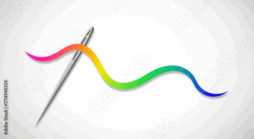 A sharp sewing needle threaded with a vibrant rainbow-colored string.