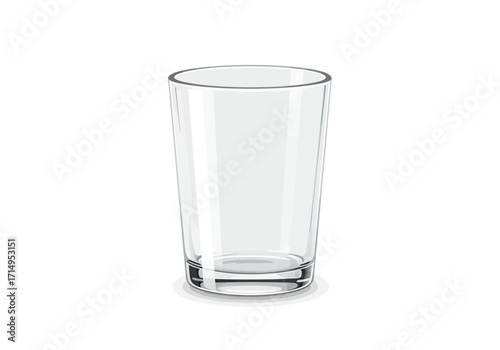 An empty clear glass stands on a white surface casting a light shadow