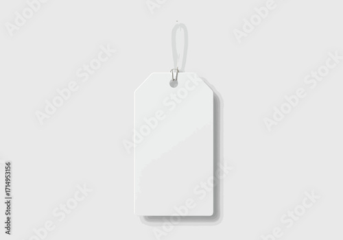An isolated white tag hangs by its string casting a faint shadow