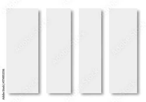 Four white rectangular paper sheets stand side by side casting soft shadows on a white surface