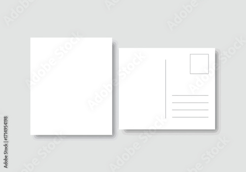 Two blank postcards one faceup one backup resting on a light gray surface