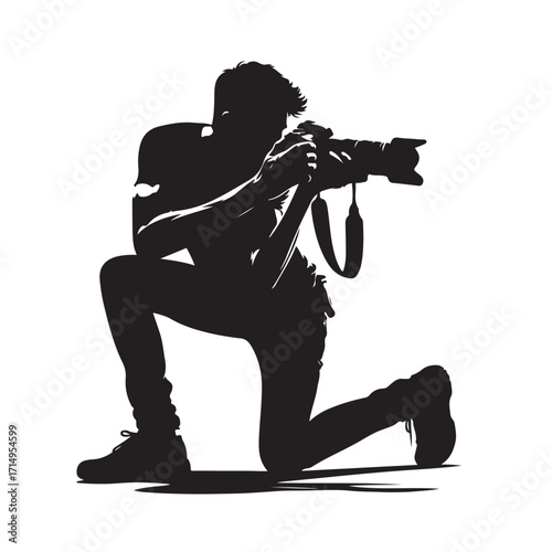 Photographer kneeling capturing image silhouette camera