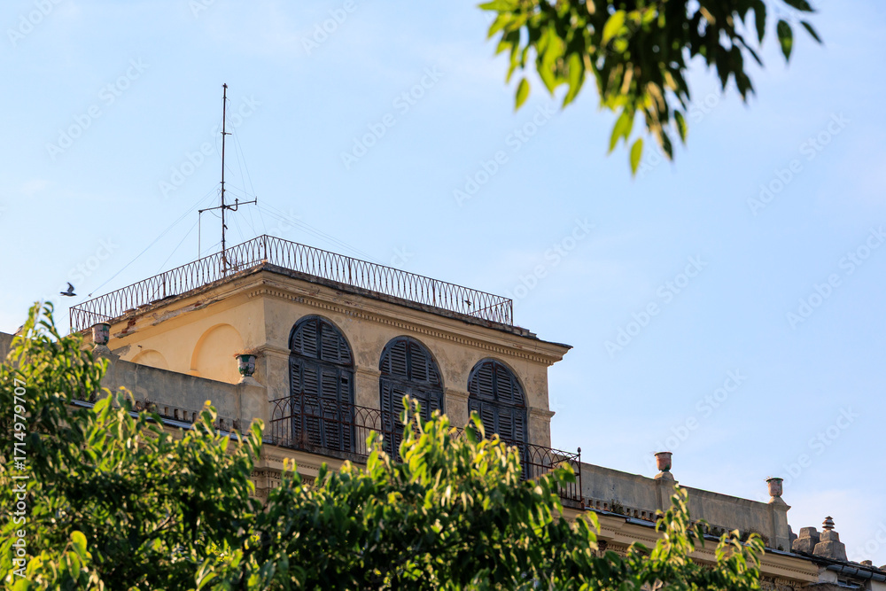 Obraz premium Historic building with arched shutters in Bastia, France, Corsica, Bastia, 20 June 2025
