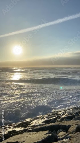 Golden sunset on the ocean beach. Cinematic sunset on the ocean. Sunset on the beach in Portugal.
