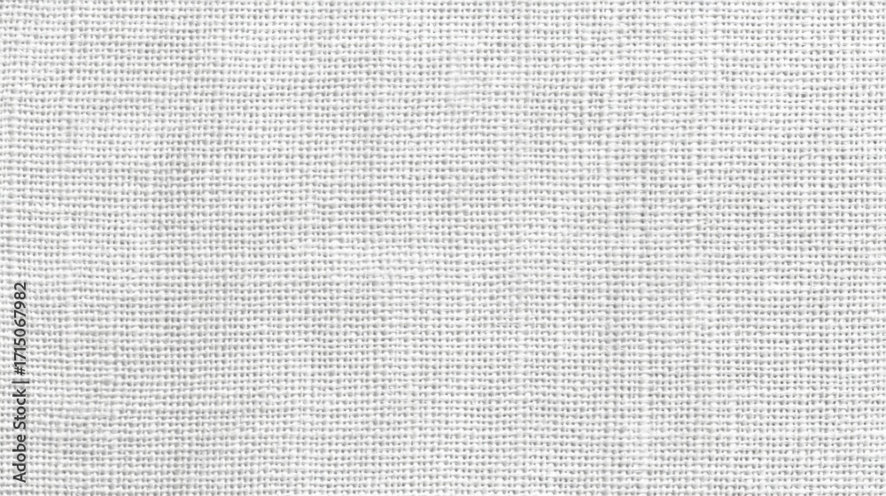 Fototapeta premium A close view of neutral textured fabric is illuminated by natural light, revealing intricate woven patterns and soft hues that are perfect for design projects.