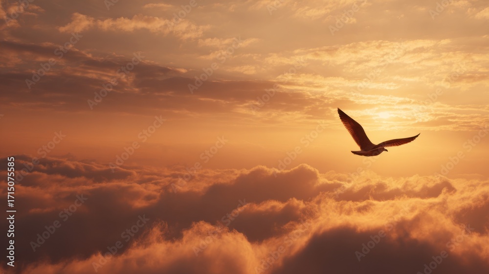 Fototapeta premium A bird glides gracefully above the soft, fluffy clouds as the sun sets, casting golden hues across the sky, creating a serene and picturesque landscape at dusk.