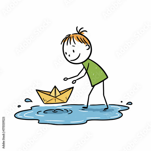 A happy child in a green shirt plays with a yellow paper boat in a puddle.