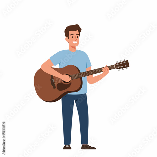 A smiling young man in a blue t-shirt and jeans playing an acoustic guitar.