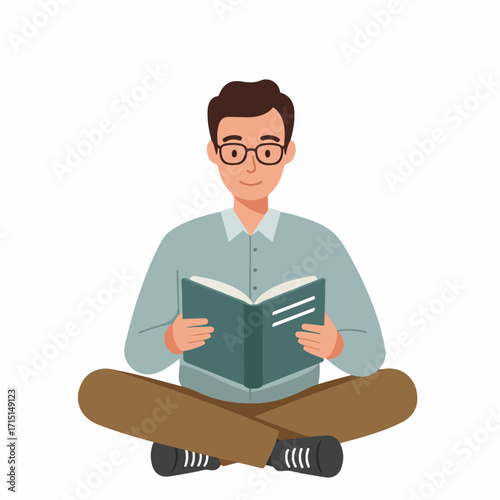 A man wearing glasses is sitting cross-legged and reading a book.
