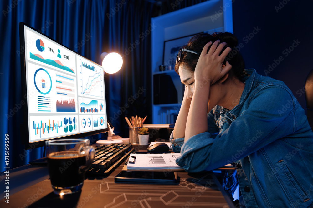 Φωτογραφία Stressful young beautiful asian creative looking on pc screen with project creator social media online with planning channel strategy reach of more viewers at neon modern office at night
