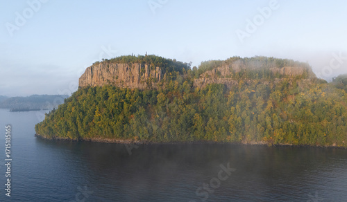 Morning fog at Ontario cliffs at Lake Superior shoreline during autumn 