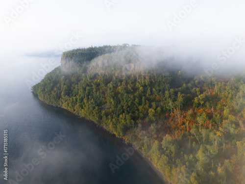 Morning fog at Ontario cliffs at Lake Superior shoreline during autumn 