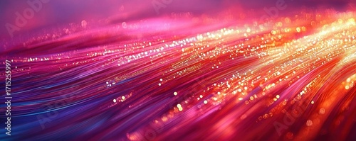 Close-up of glowing fiber optic cables emitting vibrant pink, purple, and orange light with sparkling points creating a dynamic and futuristic atmosphere
