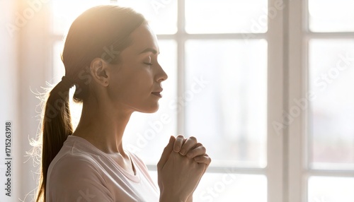 Woman Praying Near Window with Soft Light Free Download Woman Praying Near Window with Soft Light - GFXLoad