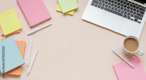 Creative Workspace Top View with Laptop and Colorful Stationery