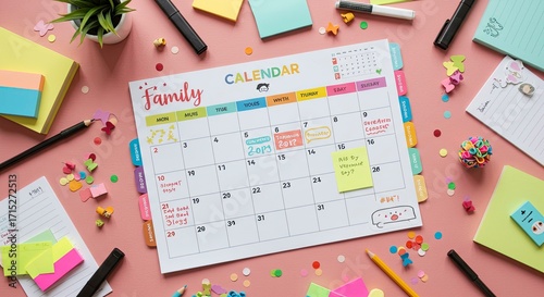 Creative Workspace with Family Calendar and Colorful Stationery Flat Lay