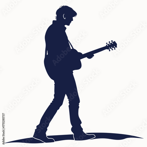 Silhouette of a young man playing an acoustic guitar while walking outdoors on a sunny day