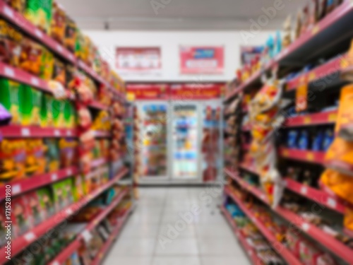 Wallpaper Mural Blurred view of supermarket aisle with colorful packaged products on shelves. Grocery store interior background with snacks, food, and retail items for consumer and shopping concepts Torontodigital.ca