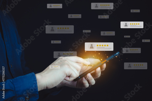 Business person using smartphone to leave or manage user ratings with virtual review interface showing stars and profiles.