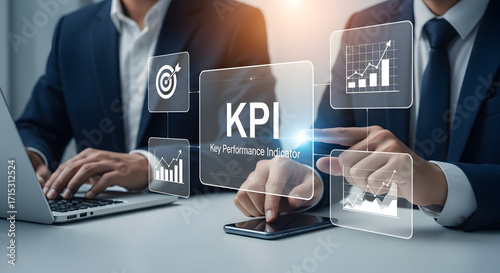 Business professionals analyzing key performance indicators KPI data on digital devices in modern office environment for strategic growth and performance improvement