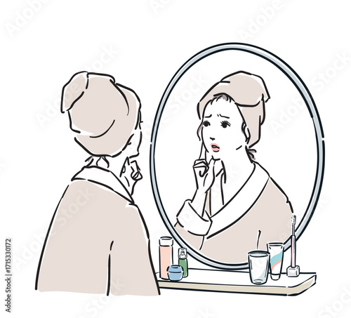 鏡の前に立つバスローブ姿の女性　トラブル