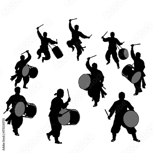 Silhouette drummers performing with large taiko drums