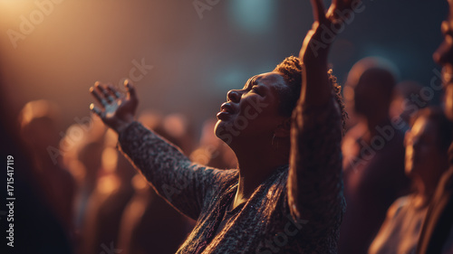 Woman worshipping with raised hand in church