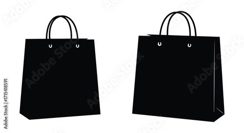 Two black paper shopping bags isolated on a clean white background