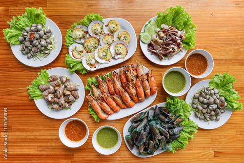 Wallpaper Mural Seafood Platter: A culinary delight showcasing an array of fresh seafood, artistically arranged on a wooden surface, offering a visual feast. Torontodigital.ca