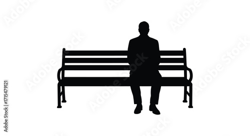 A solitary figure sits pensively on a park bench in silhouette