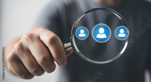 A man is holding a magnifying glass over a group of people icons
