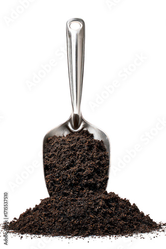 Dark Brown Granular Material In Metal Scoop