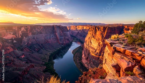 A breathtaking vista of a canyon landscape at sunset, showcasing vibrant colors and rugged rock formations.