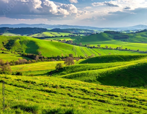 Lush green hills and valleys stretch out under a vibrant sky, showcasing a peaceful rural landscape.