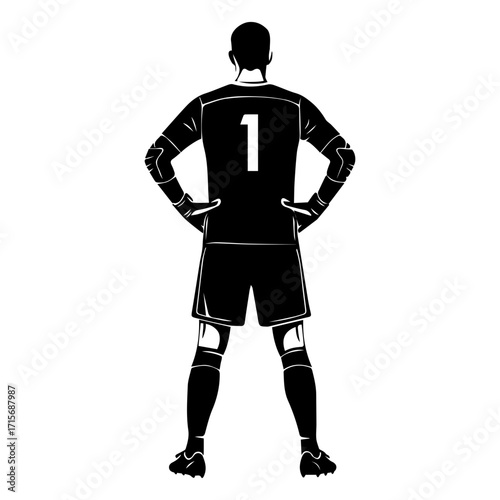 Silhouette of a back view of a soccer goalkeeper standing with hands on hips