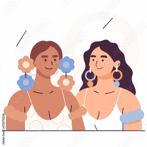 Two women smiling while showcasing colorful earrings and floral accessories  