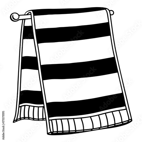 Striped hand towel hanging on a rack in black and white design  