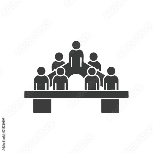 A minimalist black silhouette icon depicts a hierarchical group of people gathered around a table, symbolizing teamwork, corporate structure, and leadership dynamics.