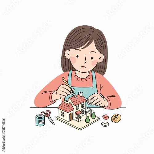Creative woman enjoying her leisure time by carefully assembling a detailed miniature house model