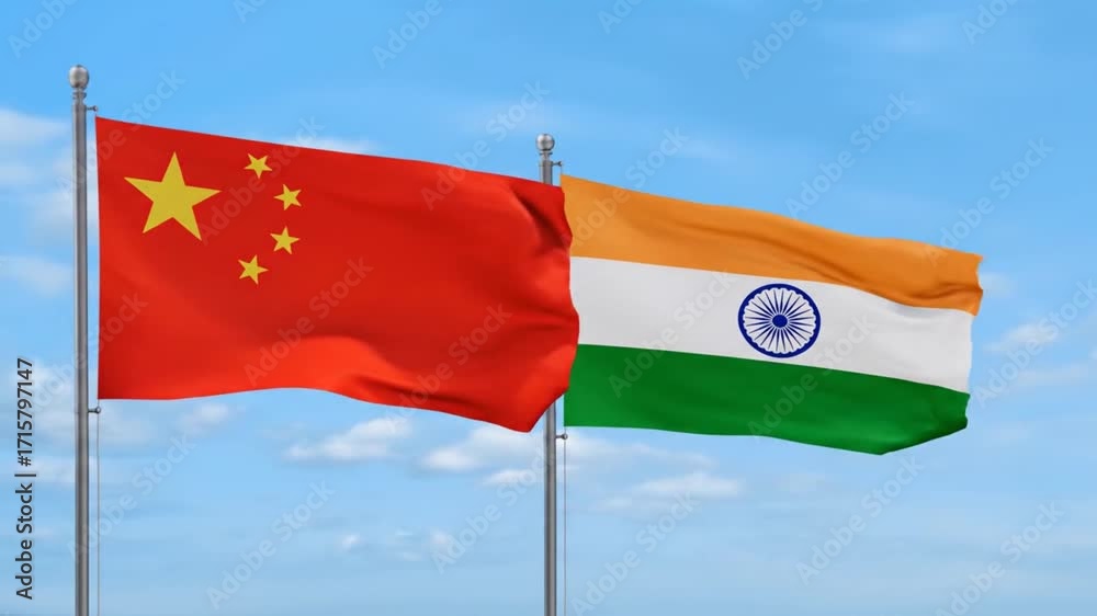 Two national flags waving in the wind the flag of china and the flag of ...