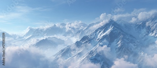 Snowy mountain peaks pierce fluffy clouds, reaching for a blue sky