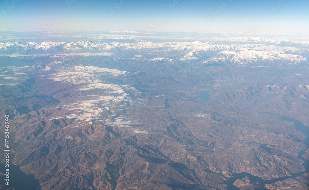 Naklejka premium Plane Window View, Snow Mountains Aircraft Fly Landscape, Looking from Plane Cabin