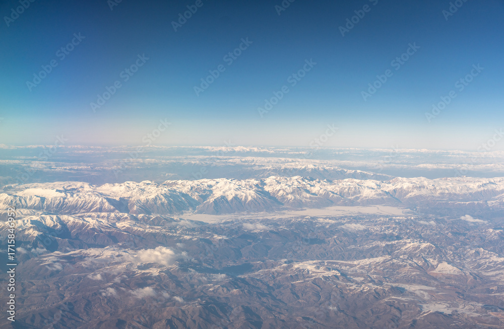 Naklejka premium Plane Window View, Snow Mountains Aircraft Fly Landscape, Looking from Plane Cabin