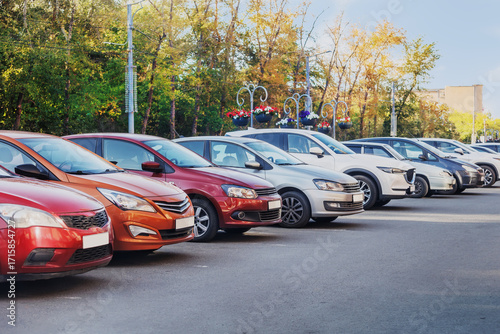 Cars parked in a row in a city parking lot