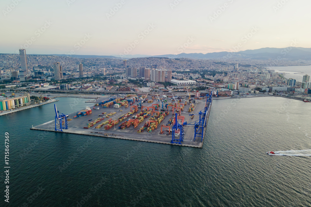 Naklejka premium Containers terminal in port with bridge cranes, aerial view. Logistics global trade infrastructure, Export and import in the sea