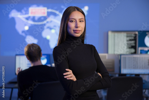 Professional Female Analyst Working in a Security Operations Center with Digital Displays